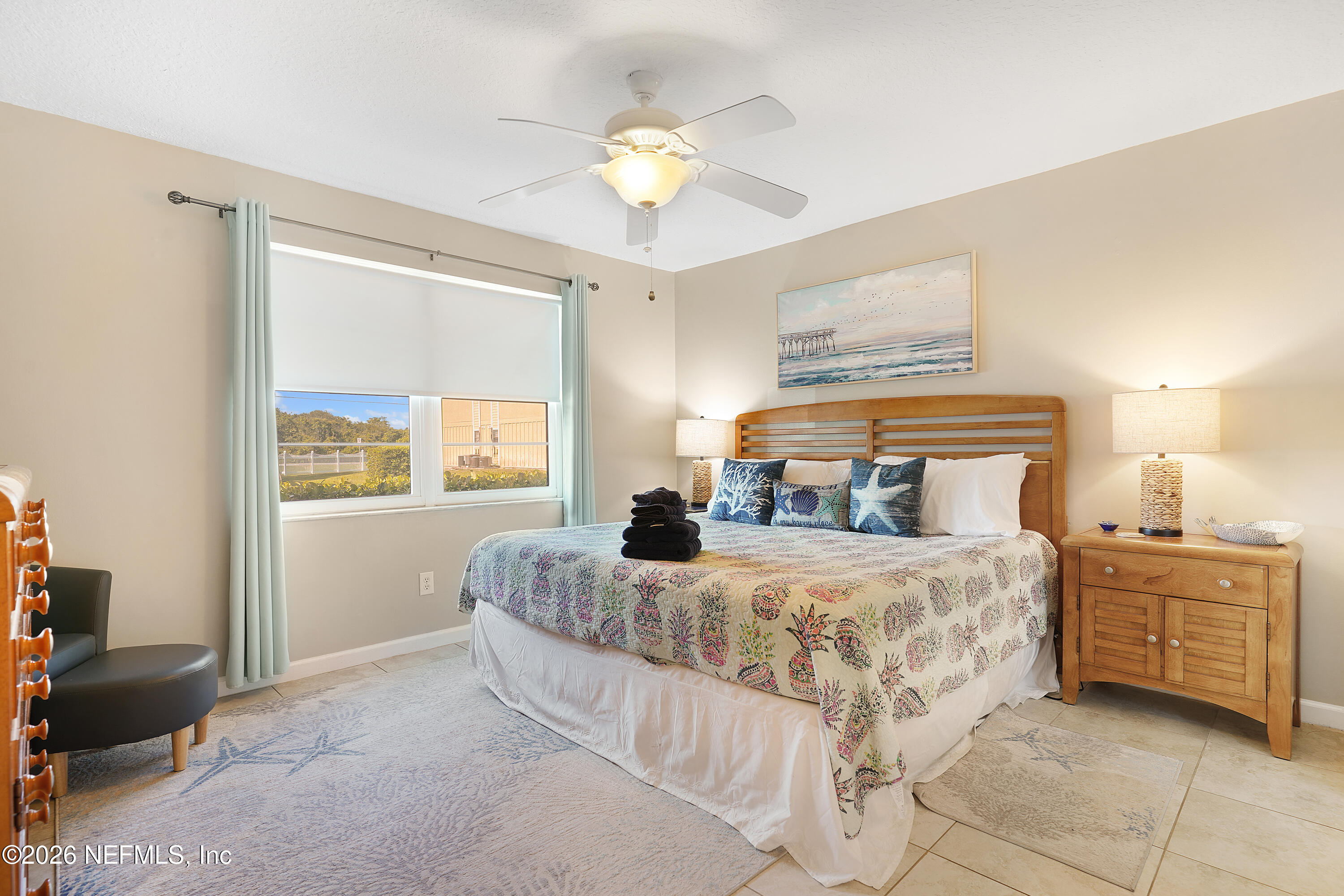 9 Clipper Court St. Augustine, FL 32080 - Photo 11 of 22 a bedroom with a bed and a chandelier
