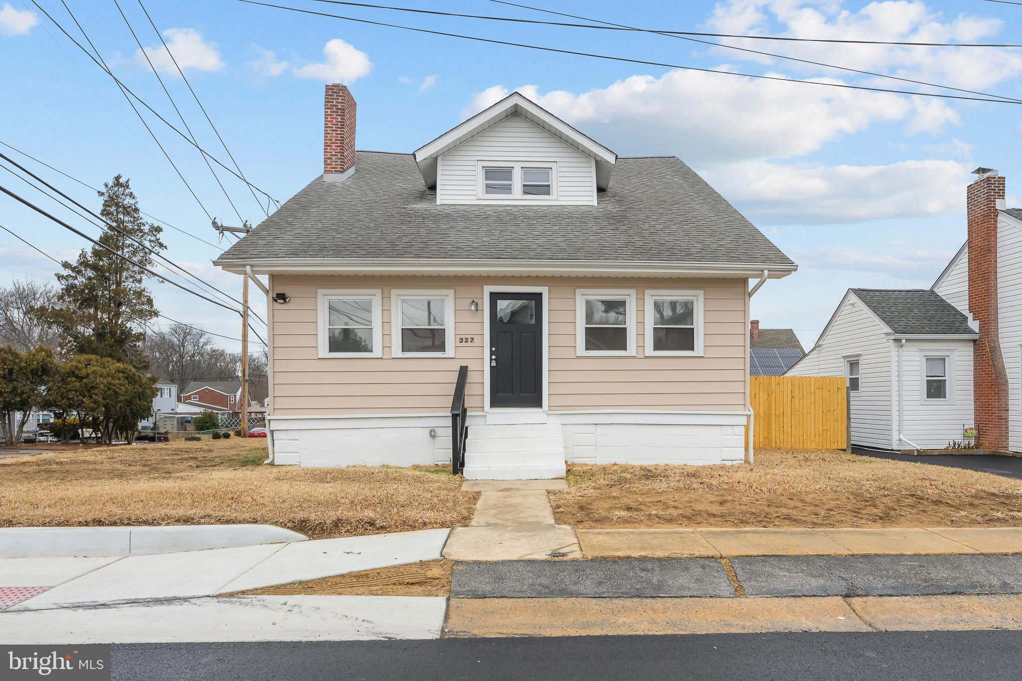 327 West Summit Avenue Wilmington, DE 19804 - Photo 1 of 26 a front view of a house with a yard and garage