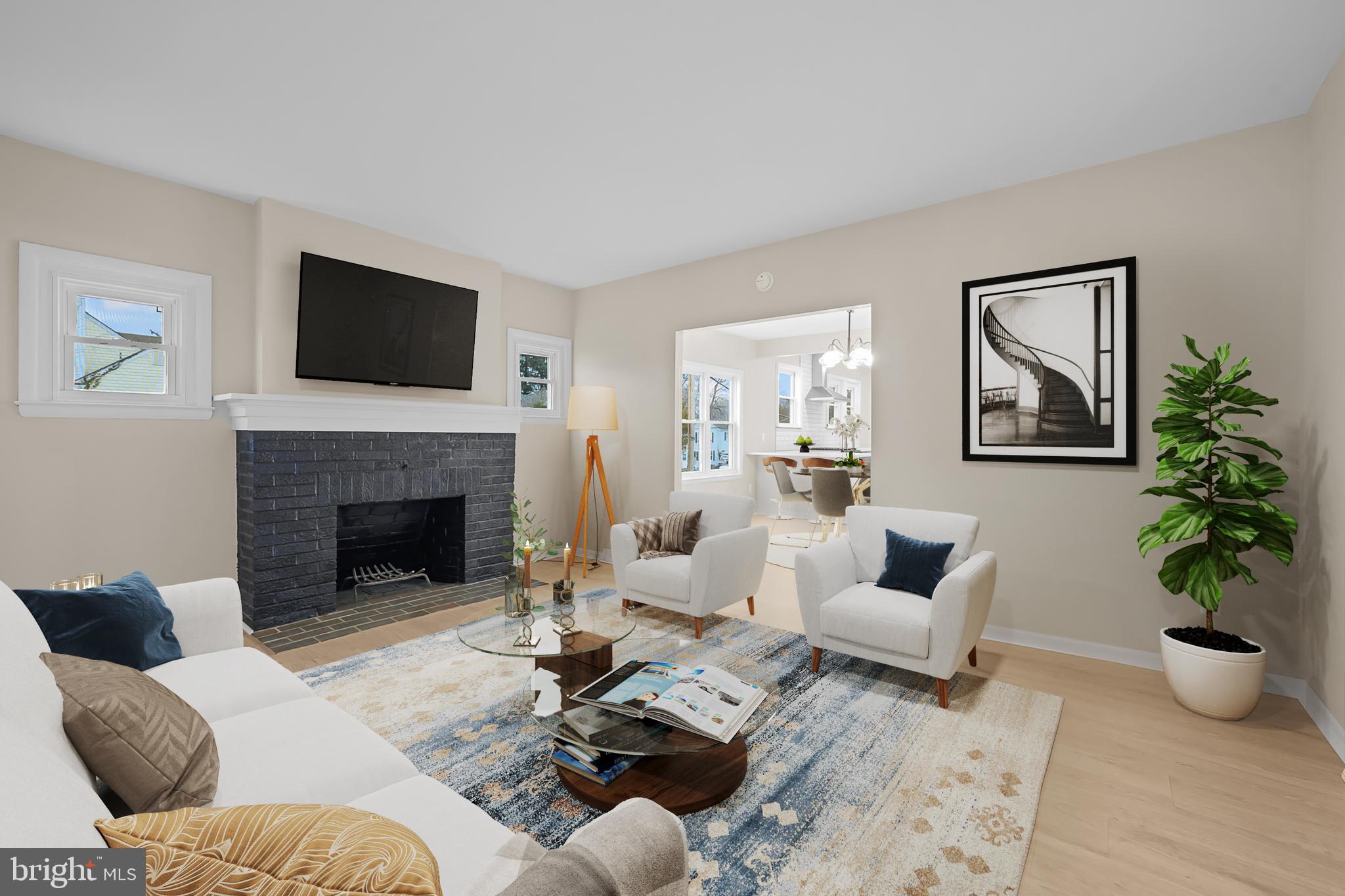327 West Summit Avenue Wilmington, DE 19804 - Photo 3 of 26 a living room with furniture fireplace and a flat screen tv