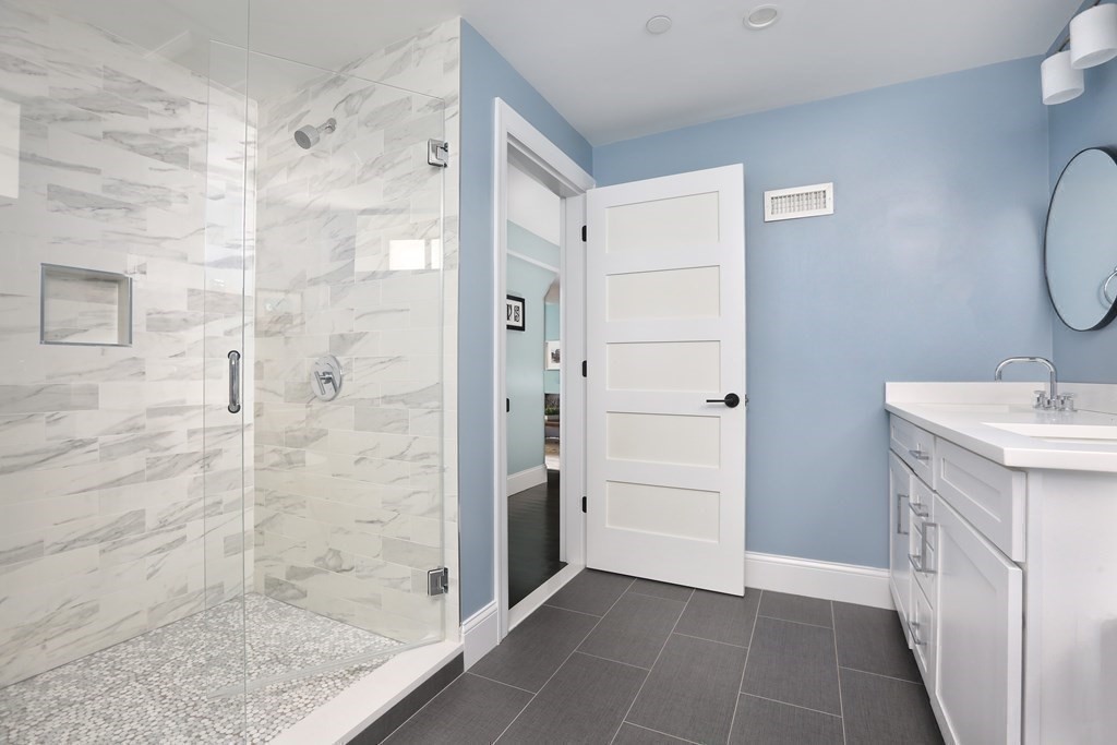 22 Roseclair Street, Unit 1 Boston, MA 02125 - Photo 11 of 14 a bathroom with a shower and a sink