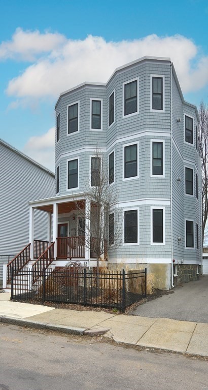 22 Roseclair Street, Unit 1 Boston, MA 02125 - Photo 13 of 14 a front view of a house with a garage