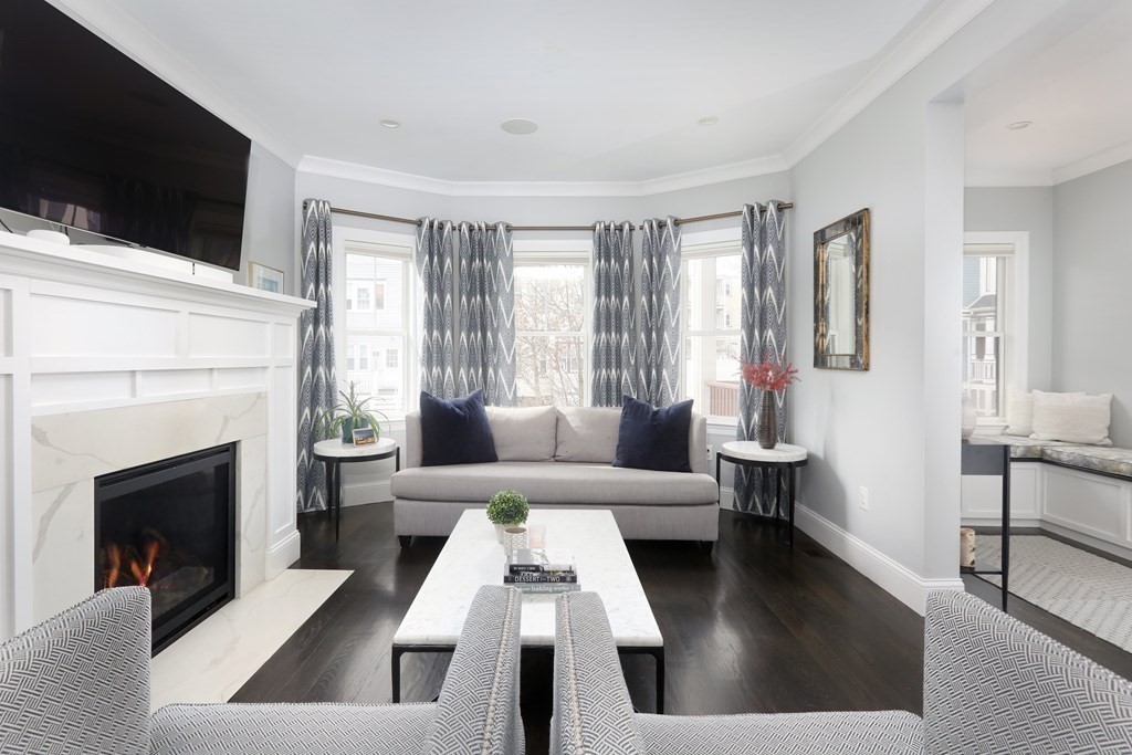 22 Roseclair Street, Unit 1 Boston, MA 02125 - Photo 3 of 14 a living room with furniture fireplace and flat screen tv