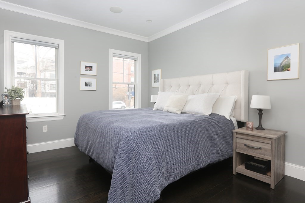 22 Roseclair Street, Unit 1 Boston, MA 02125 - Photo 5 of 14 a bedroom with a bed and a window