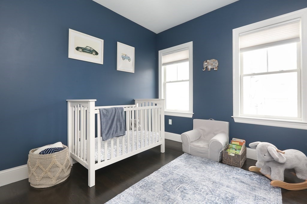 22 Roseclair Street, Unit 1 Boston, MA 02125 - Photo 7 of 14 a bed room with a bed and a window