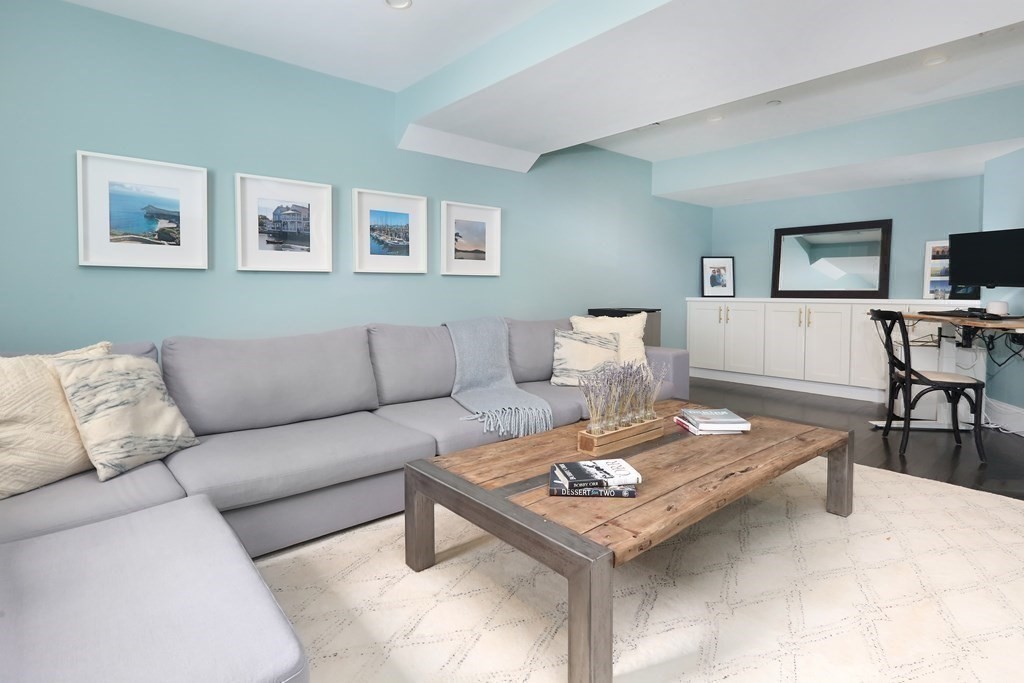 22 Roseclair Street, Unit 1 Boston, MA 02125 - Photo 9 of 14 a living room with furniture and a table