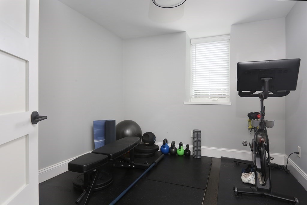 22 Roseclair Street, Unit 1 Boston, MA 02125 - Photo 10 of 14 a room with furniture and a window