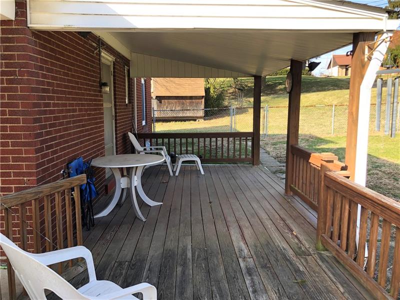 2650 Ridge Rd Extension Baden, PA 15005 - Photo 22 of 25 Rear patio is partially covered, the perfect spot for gatherings or quiet time alone.