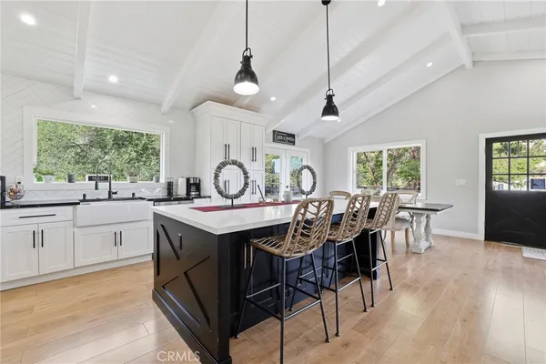 a bedroom with a bed a window and a dresser