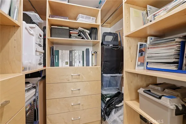 a bathroom with a double vanity sink toilet and shower