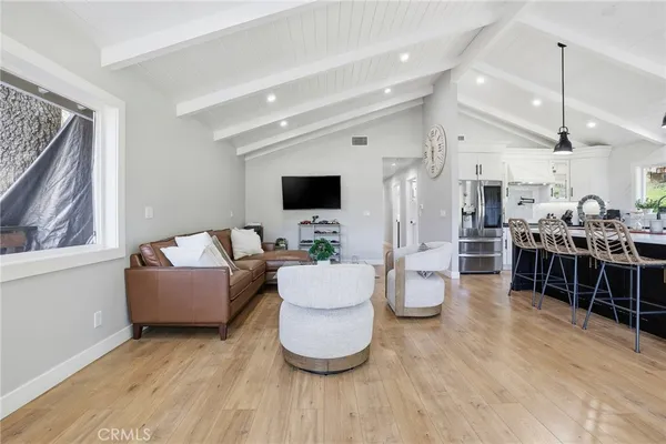 a kitchen with a sink a counter top space and a large window