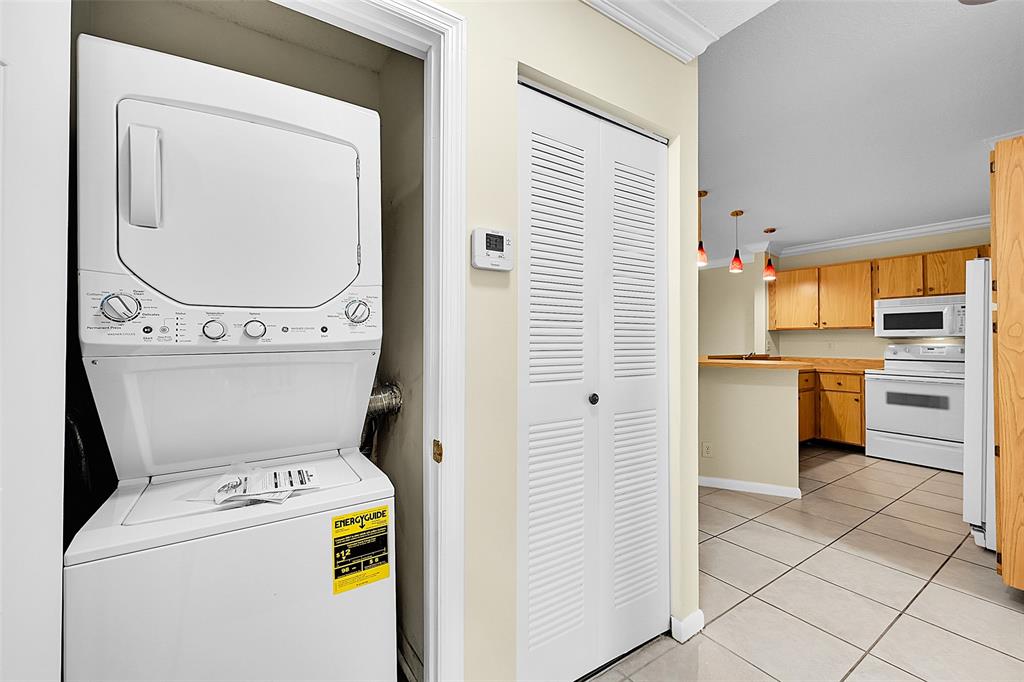22306 Timberly Drive, Unit 22306 Boca Raton, FL 33428 - Photo 16 of 26 a utility room with dryer and washer