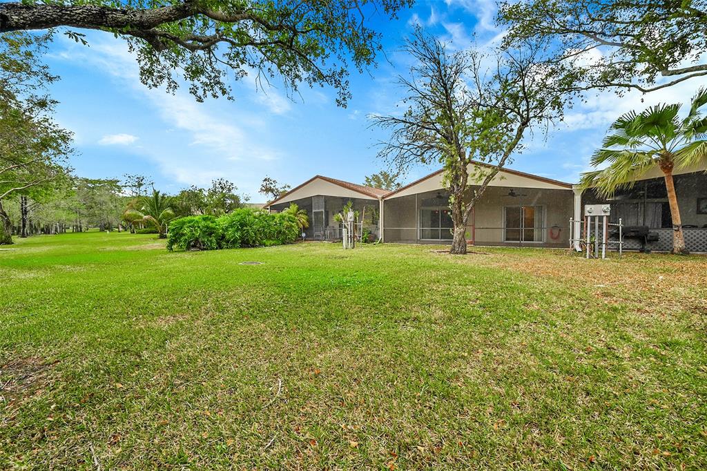 22306 Timberly Drive, Unit 22306 Boca Raton, FL 33428 - Photo 26 of 26 a house view with a garden space
