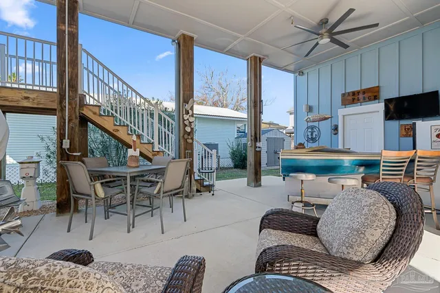 a view of a balcony with furniture