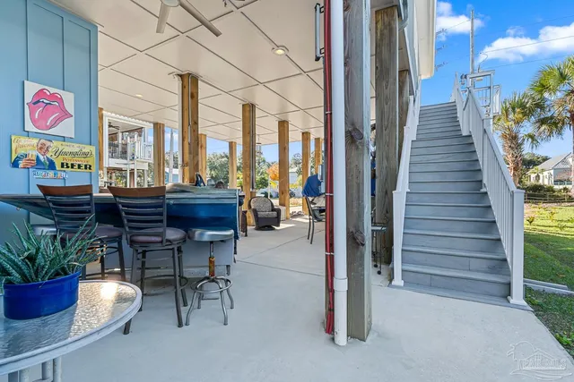 a view of a balcony with wooden floor and fence