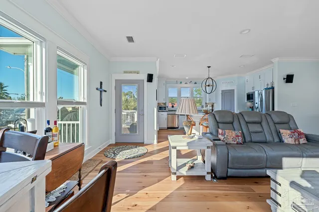 a kitchen with a table chairs and a refrigerator