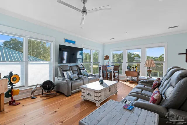a kitchen with a table chairs sink and cabinets