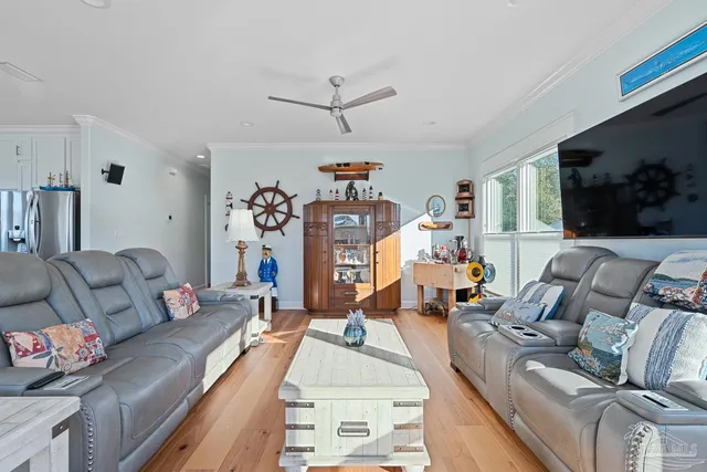 a bedroom with a bed window and a flat screen tv