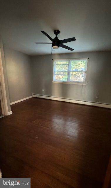 203 Robbins Street Philadelphia, PA 19111 - Photo 13 of 31 an empty room with wooden floor and windows