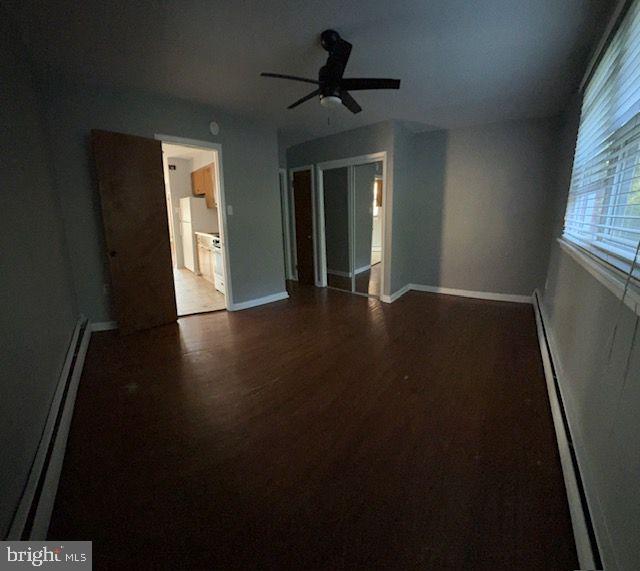 203 Robbins Street Philadelphia, PA 19111 - Photo 14 of 31 a view of an empty room with wooden floor and a window