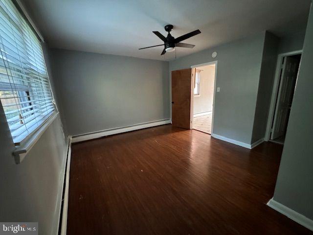 203 Robbins Street Philadelphia, PA 19111 - Photo 16 of 31 an empty room with wooden floor fan and windows