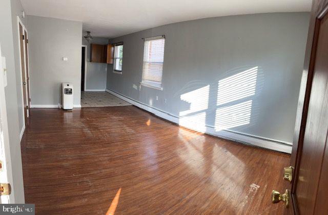 203 Robbins Street Philadelphia, PA 19111 - Photo 8 of 31 a view of empty room with wooden floor and fan