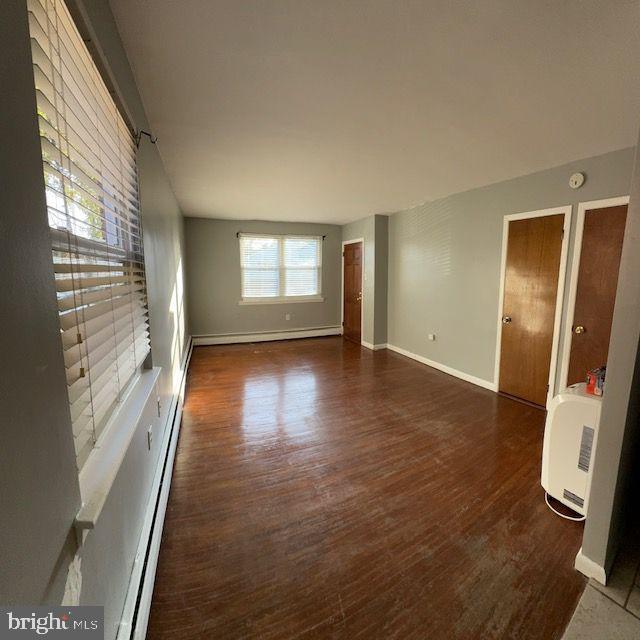 203 Robbins Street Philadelphia, PA 19111 - Photo 10 of 31 a view of an empty room with a window and wooden floor