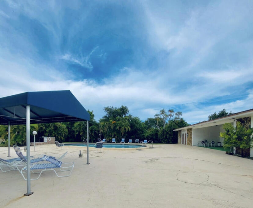 1100 Tallwood Avenue, Unit 201 Hollywood, FL 33021 - Photo 17 of 18 a view of a house with backyard and porch