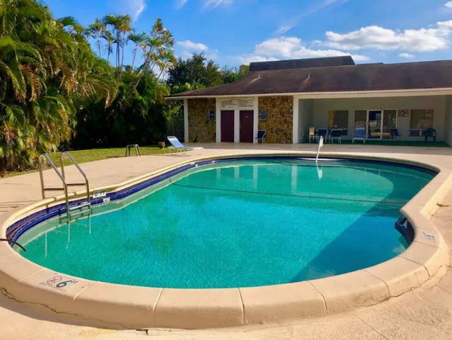 a view of a house with swimming pool