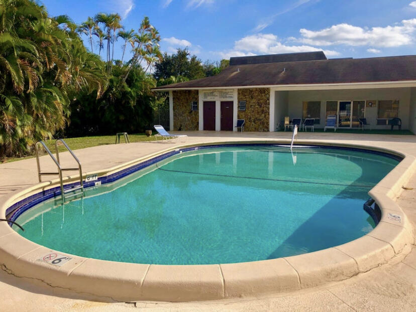 1100 Tallwood Avenue, Unit 201 Hollywood, FL 33021 - Photo 18 of 18 a view of a house with swimming pool