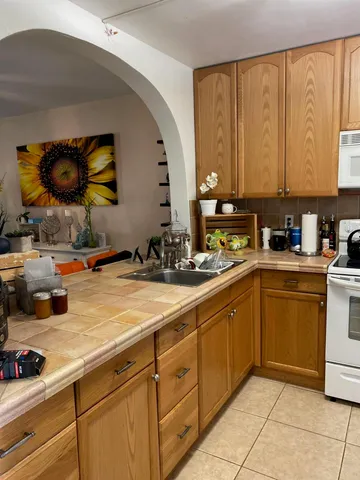 a kitchen with a sink and cabinets