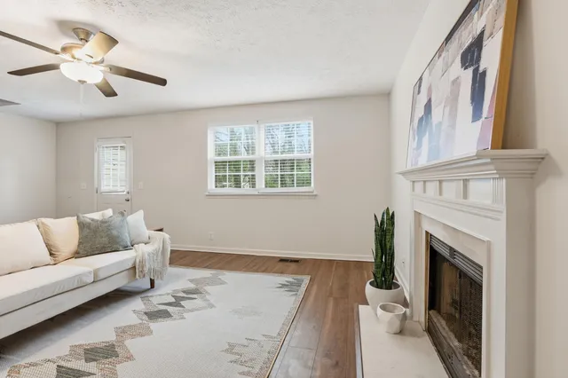 a living room with furniture and a fireplace