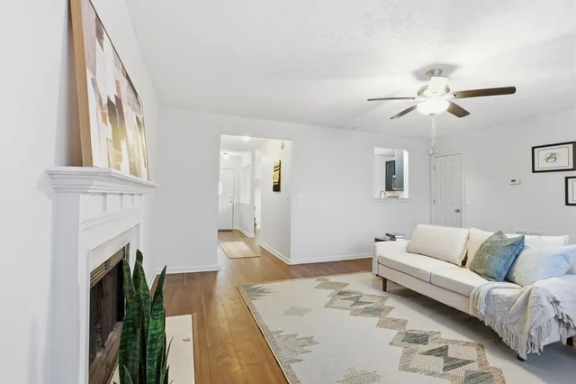 a living room with furniture and a fireplace