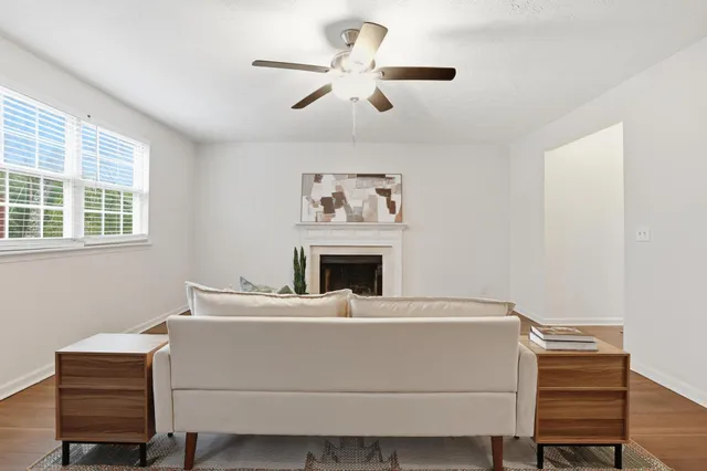 a living room with a couch and a fireplace