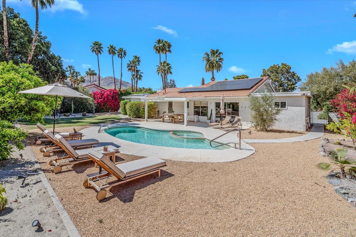 73149 Haystack Road Palm Desert, CA 92260 - Photo 12 of 32 an aerial view of a house with a garden and swimming pool