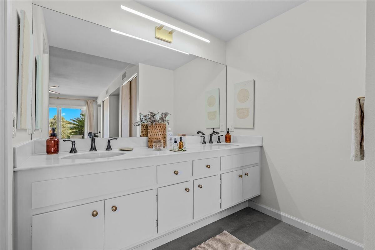 73149 Haystack Road Palm Desert, CA 92260 - Photo 15 of 32 a bathroom with a double vanity sink and mirror