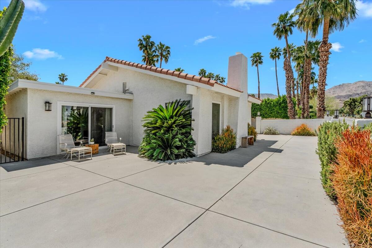 73149 Haystack Road Palm Desert, CA 92260 - Photo 18 of 32 a view of a house with backyard and swimming pool
