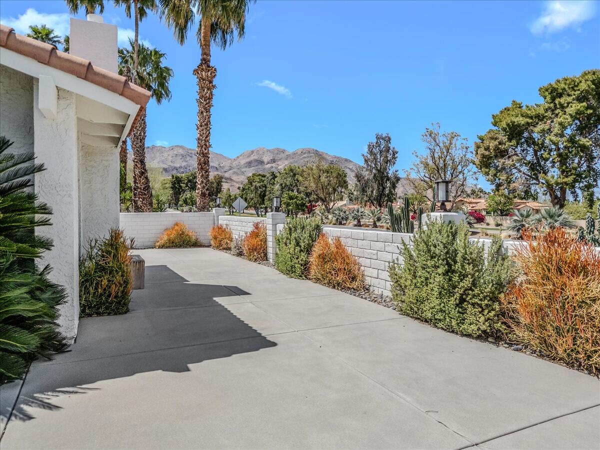 73149 Haystack Road Palm Desert, CA 92260 - Photo 19 of 32 a view of a terrace with a garden