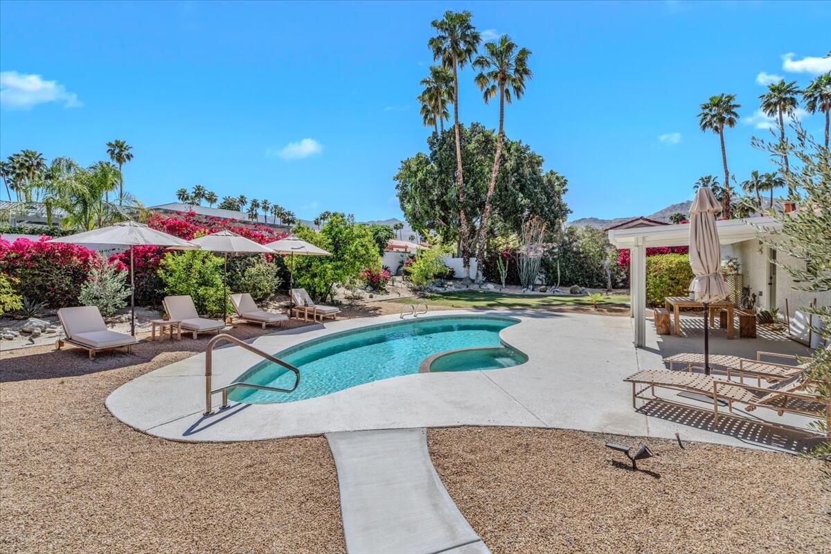 73149 Haystack Road Palm Desert, CA 92260 - Photo 23 of 32 a view of a swimming pool with a patio
