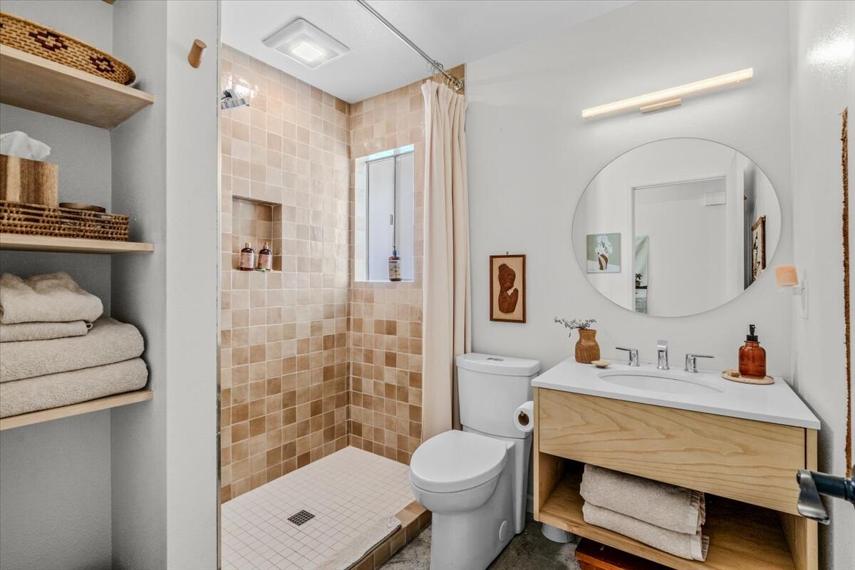 73149 Haystack Road Palm Desert, CA 92260 - Photo 26 of 32 a bathroom with a sink toilet and shower