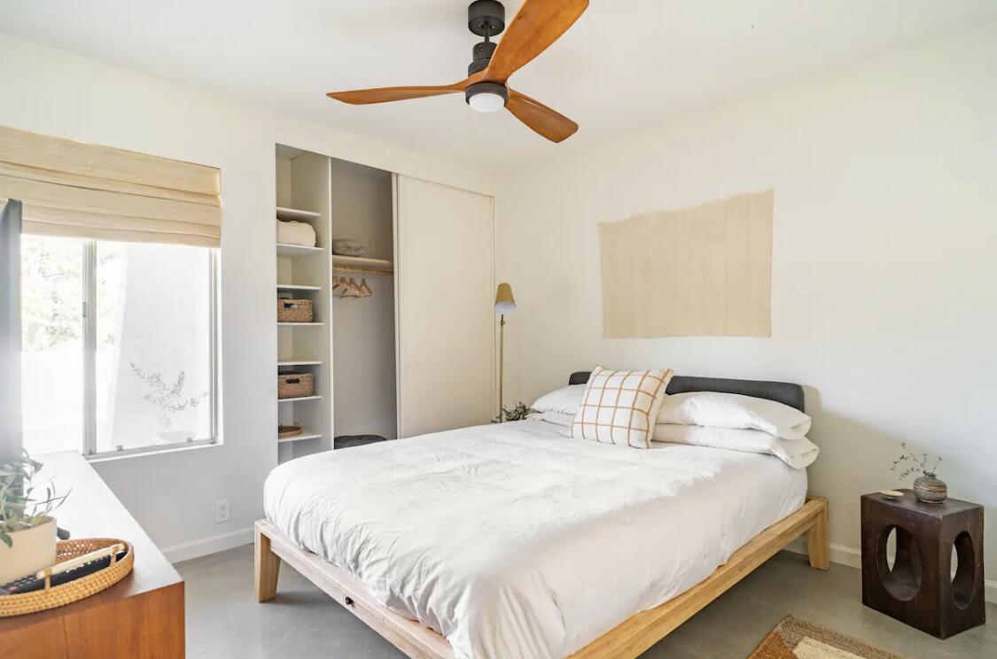 73149 Haystack Road Palm Desert, CA 92260 - Photo 27 of 32 a bedroom with a bed and a window