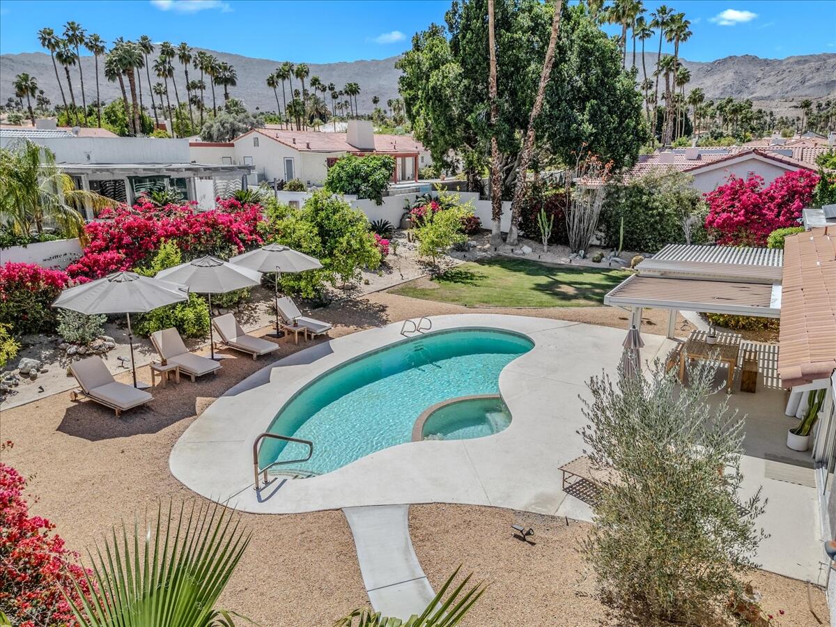 73149 Haystack Road Palm Desert, CA 92260 - Photo 31 of 32 a view of a swimming pool with sitting area