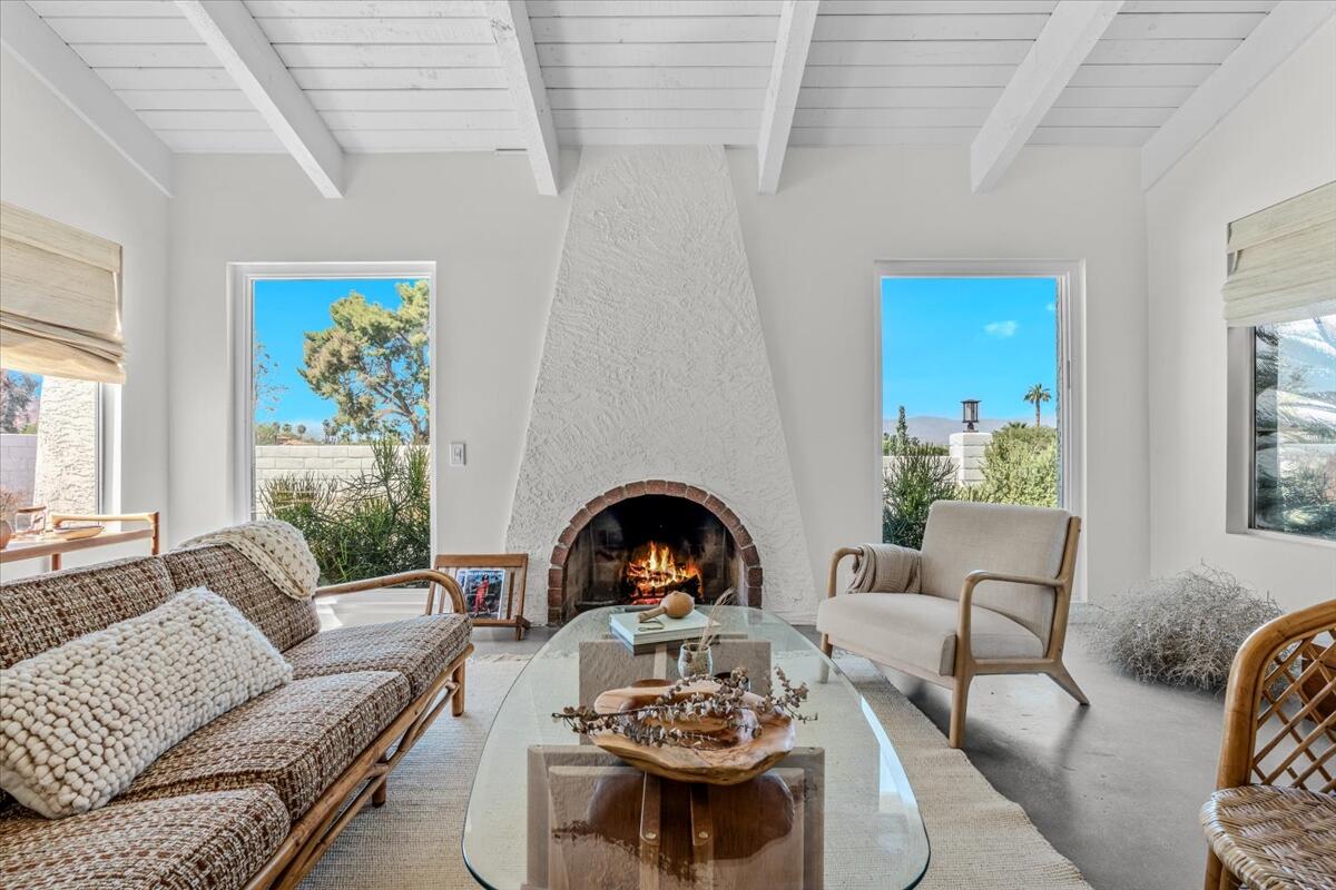 73149 Haystack Road Palm Desert, CA 92260 - Photo 6 of 32 a living room with furniture and a fireplace