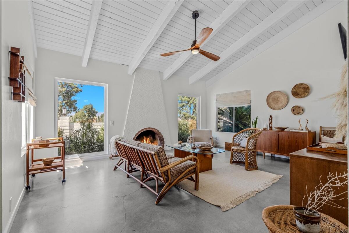 73149 Haystack Road Palm Desert, CA 92260 - Photo 10 of 32 a living room with furniture and a large window