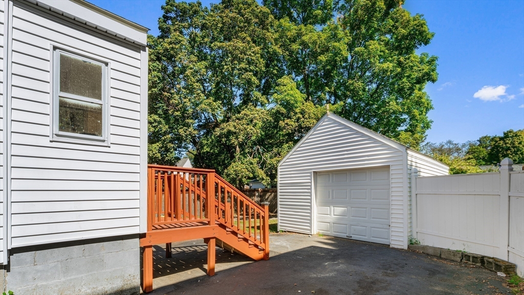 463 Lincoln Street Waltham, MA 02451 - Photo 18 of 23 a view of a house with a yard and a large tree