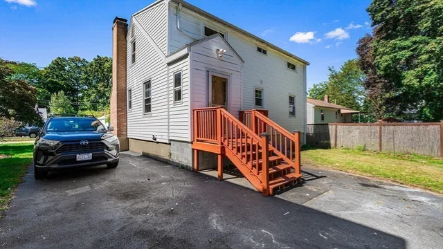 a view of backyard with deck and seating area