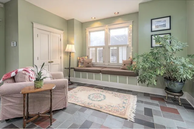a living room with furniture and a window