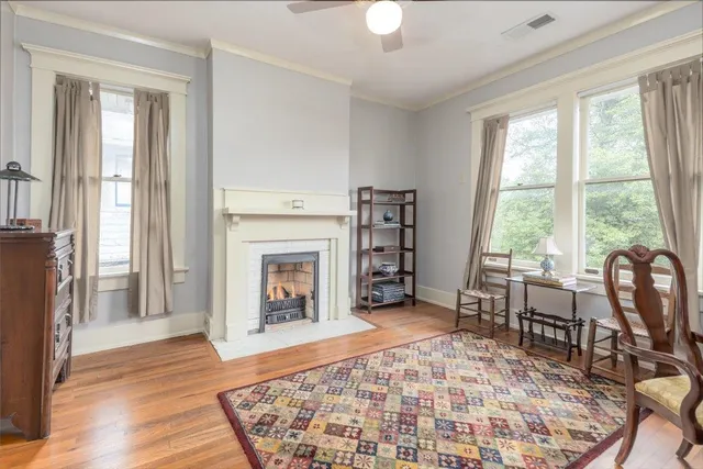 a living room with furniture and a fireplace
