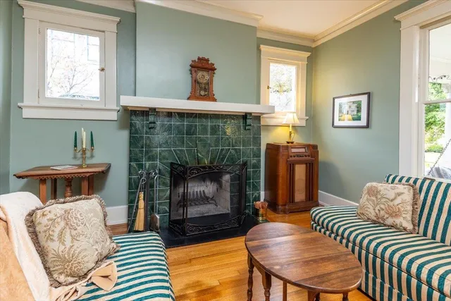 a living room with furniture and a fireplace