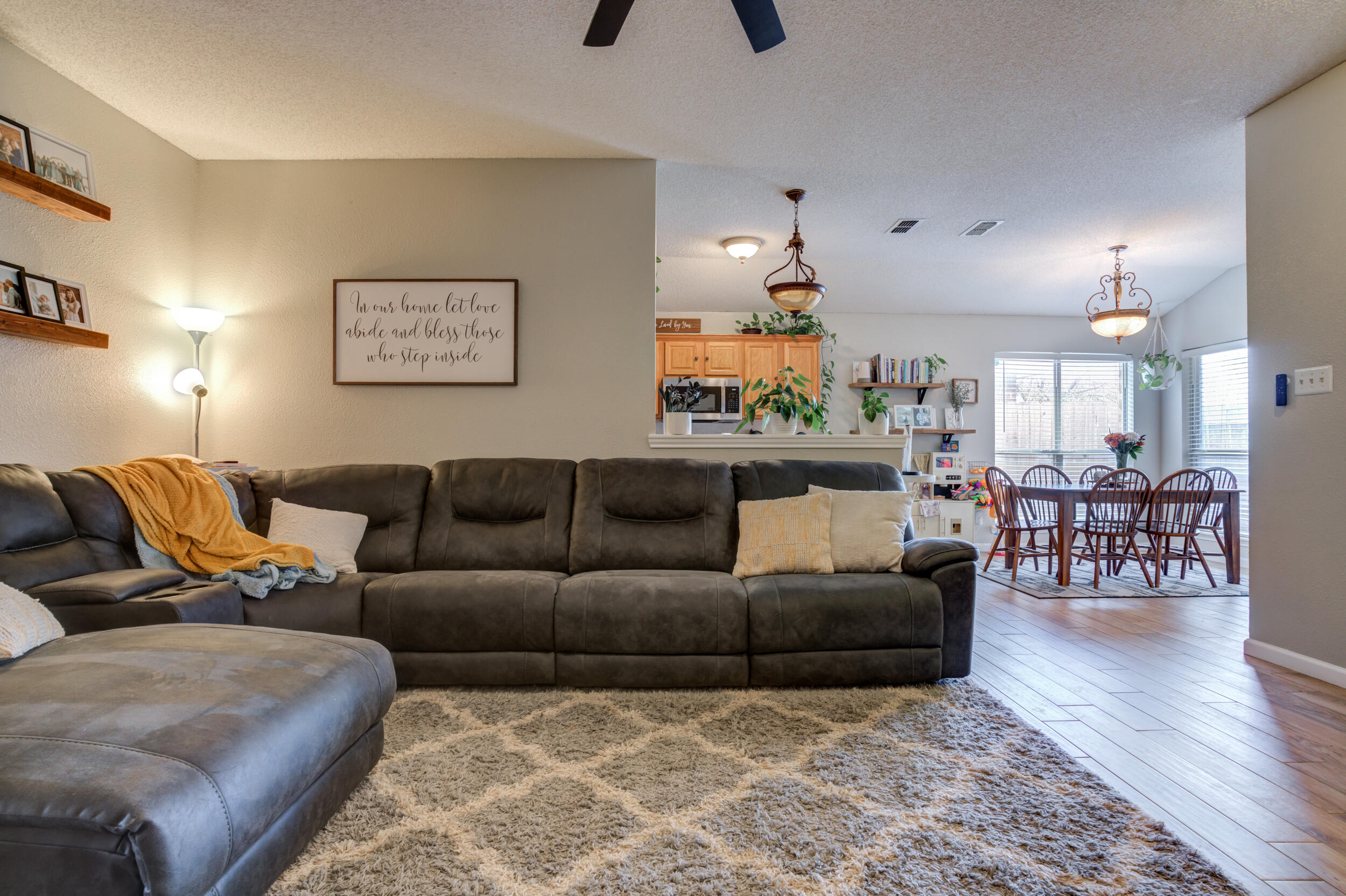 1607 79th Street Lubbock, TX 79423 - Photo 14 of 53 a living room with furniture and a wooden floor