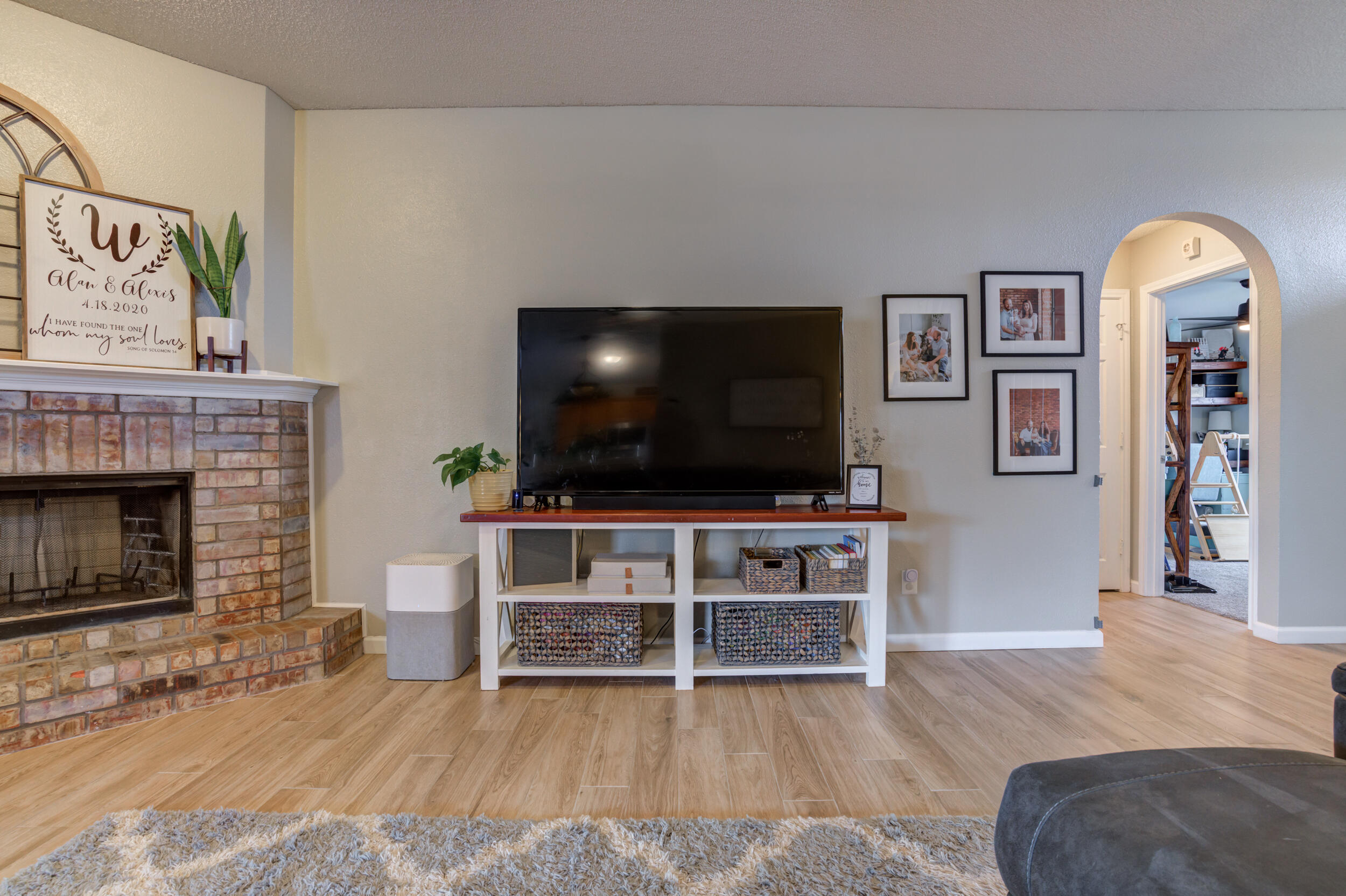 1607 79th Street Lubbock, TX 79423 - Photo 15 of 53 a living room with furniture and a flat screen tv